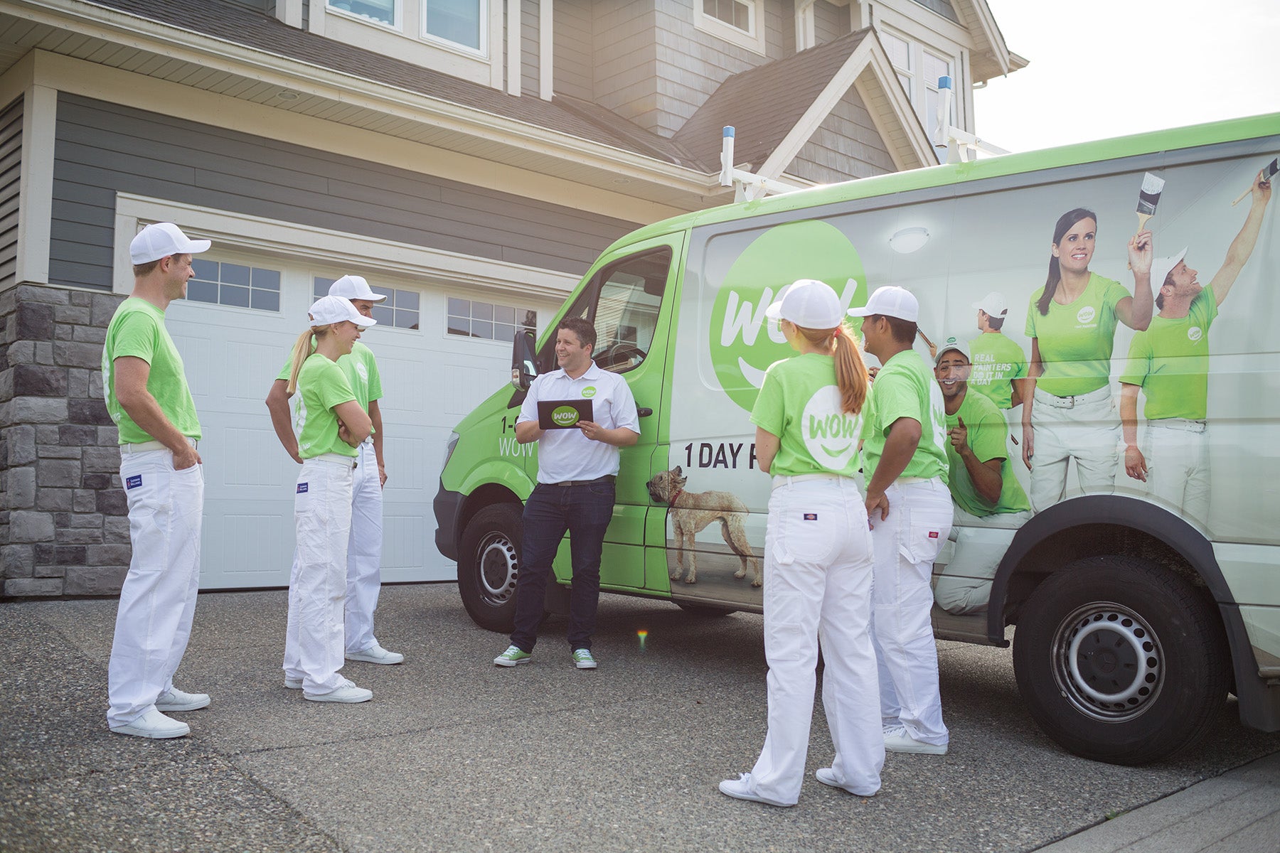 wow1daypainting happy employees in uniform meeting before starting work